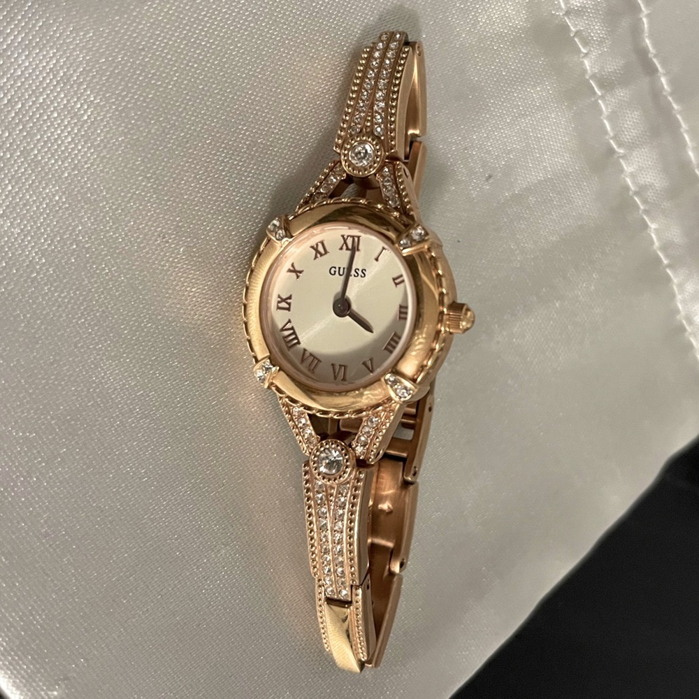 Rose gold watch with diamonds crystals
